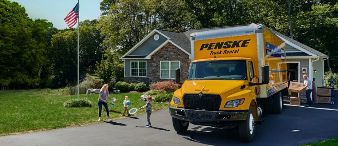 DP Moving & Storage Penske truck traveling on interstate for long distance relocation move