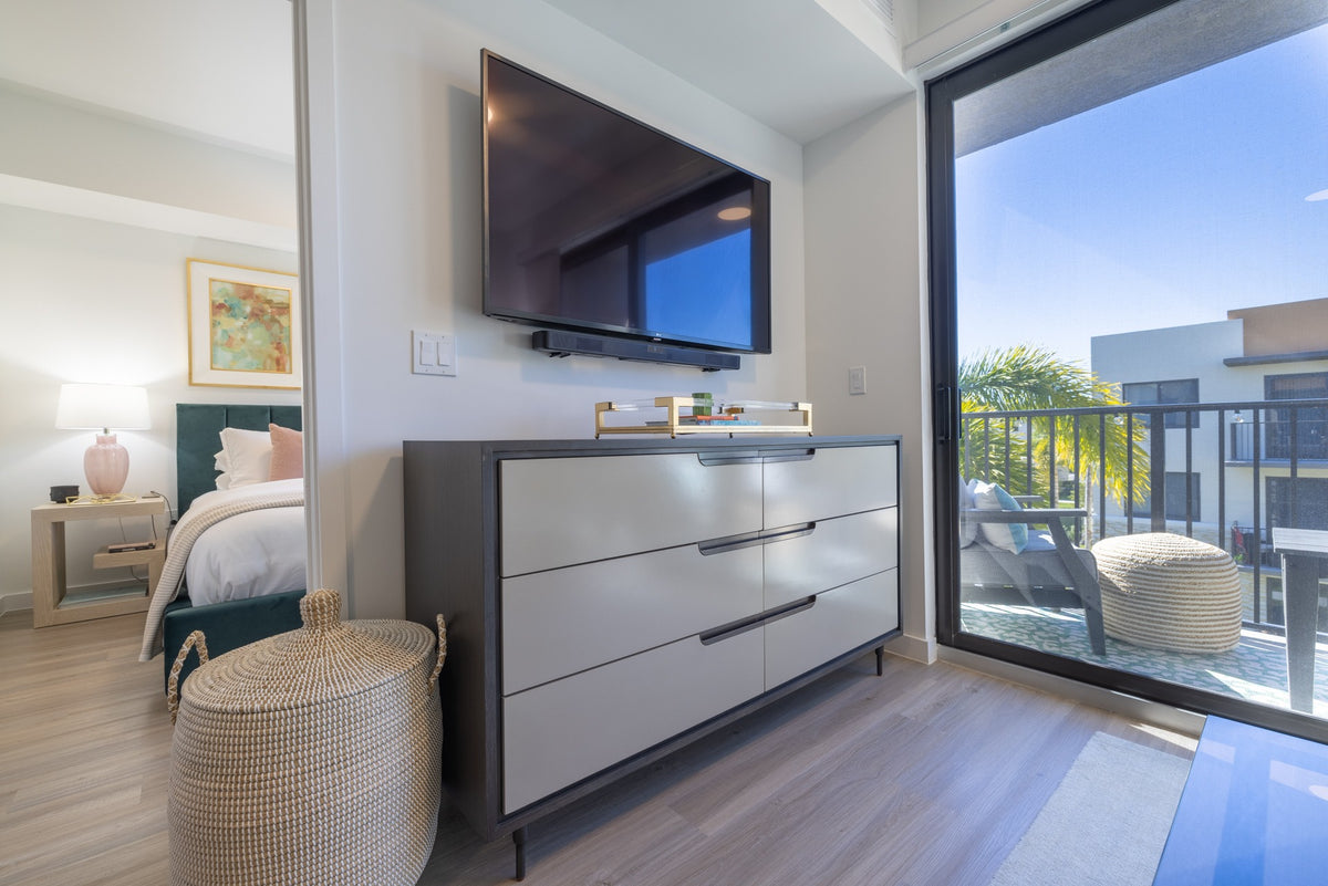 Large gray six-drawer dresser in its finished position in the apartment.